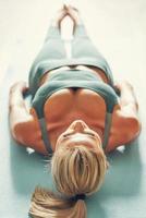 Adult woman practising yoga at home photo