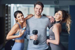 Group of people working out in a gym photo