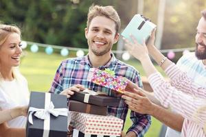 Group of friends having fun at birthday party photo