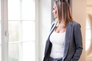 Businesswoman resting in hotel room photo