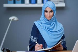 Muslim female student learning at home photo