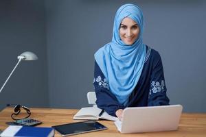 Muslim female student learning at home photo