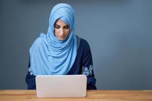 Muslim female student learning at home photo