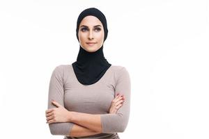 Muslim woman over white background photo