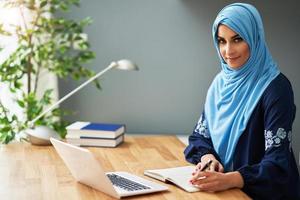 Muslim female student learning at home photo