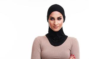 Muslim woman over white background photo