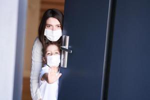 Mother and child at home quarantine during coronavirus pandemic photo