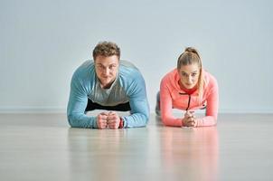 Woman with her personal fitness trainer photo
