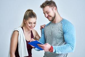 Woman with her personal fitness trainer photo