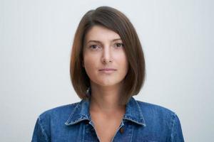 Face portrait of attractive woman over white background photo