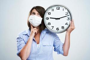 Attractive woman wearing protective mask isolated over white background photo