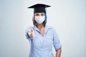 Student wearing protective mask isolated over white background photo