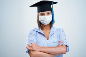 Student wearing protective mask isolated over white background photo