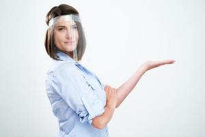 Attractive woman wearing protective mask isolated over white background photo