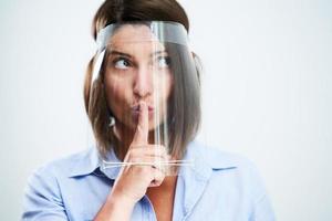 Attractive woman wearing protective mask isolated over white background photo