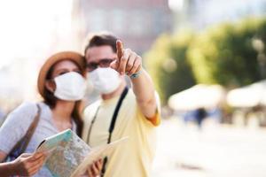 Adult tourists in masks sightseeing Gdansk Poland photo