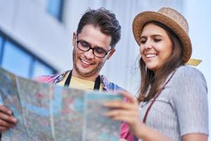 Adult happy tourists sightseeing Gdansk Poland in summer photo