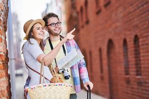 Adult happy tourists sightseeing Gdansk Poland in summer photo