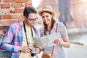 Adult happy tourists sightseeing Gdansk Poland in summer photo