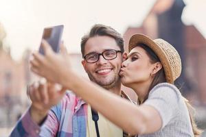 Adult happy tourists sightseeing Gdansk Poland in summer photo