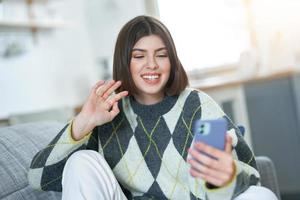 Teenage girl texting at home photo