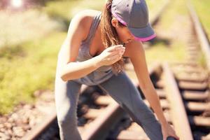 Female jogger running in the countryside photo