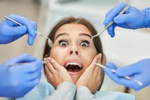 Male dentist and woman in dentist office photo