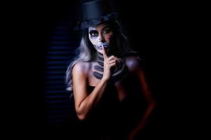 Spooky portrait of woman in halloween gotic makeup photo