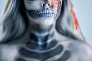 Spooky portrait of woman in halloween gotic makeup photo