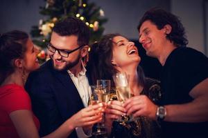 Two beautiful young couples having fun at New Year's Eve Party photo