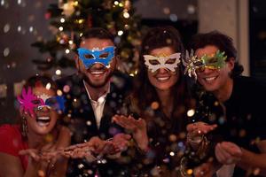 Two beautiful young couples having fun at New Year's Eve Party photo