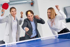 Business people relaxing in shared office space photo