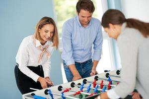 Business people relaxing in shared office space photo