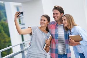 Group of students using smartphone in the campus photo
