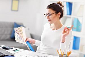 Woman working in her home office photo