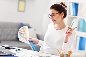 Woman working in her home office photo