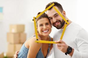 Happy adult couple moving out or in to new home photo