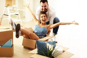 Happy adult couple moving out or in to new home photo