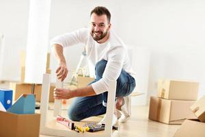 Happy adult couple moving out or in to new home photo