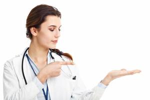 Woman doctor isolated over white background photo