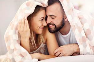 Adult attractive couple in bed photo