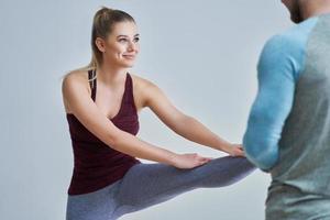 Woman with her personal fitness trainer photo