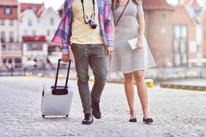 Adult happy tourists sightseeing Gdansk Poland in summer photo