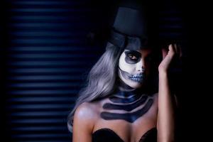 Spooky portrait of woman in halloween gotic makeup photo