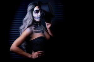 Spooky portrait of woman in halloween gotic makeup photo