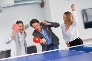 Business people relaxing in shared office space photo