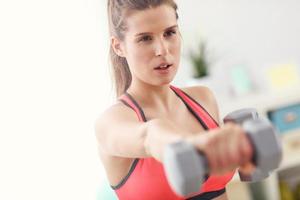 Woman doing fitness exercises at home photo