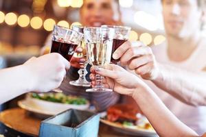 Group Of Friends Enjoying Meal In Restaurant photo