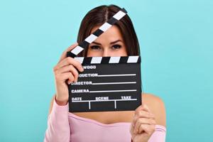 Woman against blue wall background photo