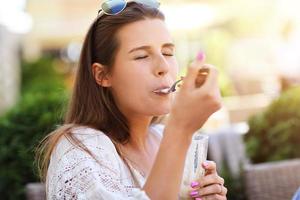 Happy girl in cafe during summer time photo